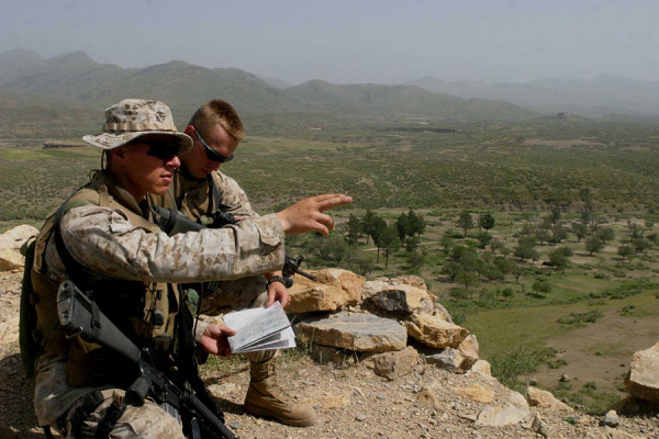 040910-M-9382M-024
Lt. Menuel Zepeda (left) and Cpl. Austin Hall (right) compare physical features of the terrain with those on a topographical map of the region near the Afghanistan/Pakistan border on Sept. 10, 2004.  Zepeda and Hall are with the 3rd Battalion 6th Marine Regiment which is conducting vehicle checkpoints and village assessments while maintaining an offensive presence throughout the region.  DoD photo by Lance Cpl. Justin M. Mason, U.S. Marine Corps.  (Released)